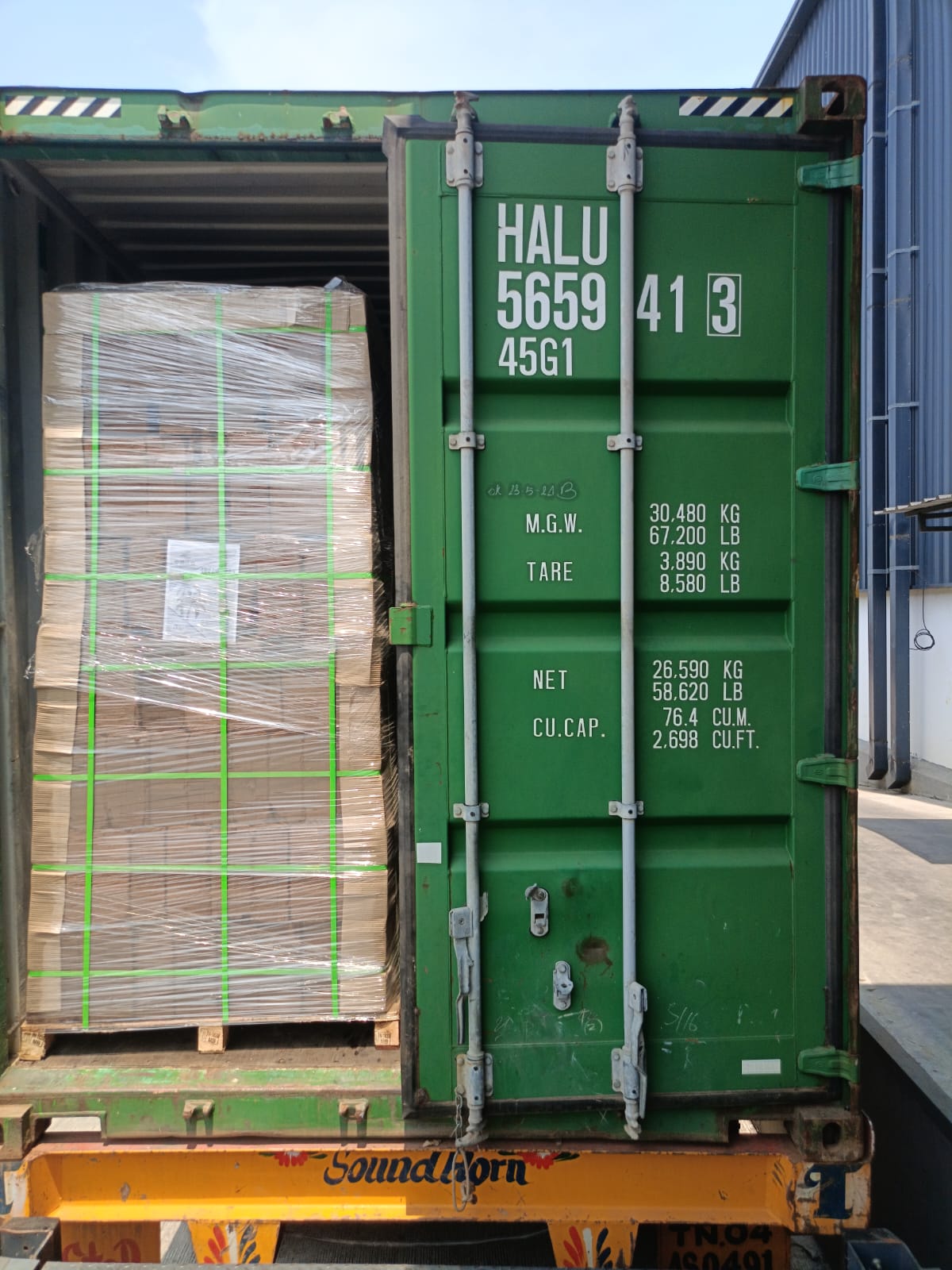 Palletized cartons ready for dispatch in green container